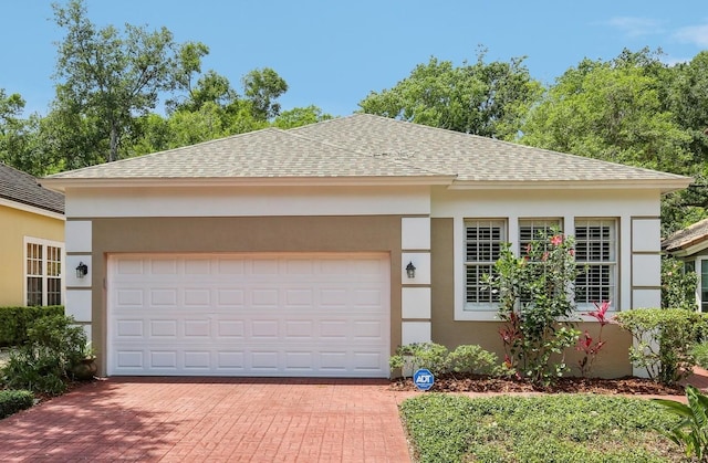 15324 Sherwood Forest Dr, Tampa, FL 33647 - garage featuring decorative driveway