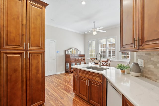 15324 Sherwood Forest Dr, Tampa, FL 33647 - kitchen with a sink, white dishwasher, a ceiling fan, decorative backsplash, and crown molding
