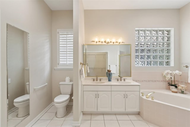 15324 Sherwood Forest Dr, Tampa, FL 33647 - full bathroom featuring toilet, a garden tub, tile patterned floors, a shower stall, and double vanity