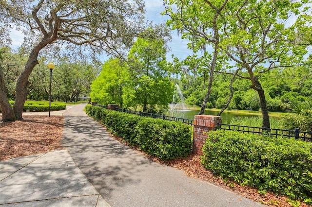 15324 Sherwood Forest Dr, Tampa, FL 33647 - surrounding community with a water view, fence, and view of scattered trees