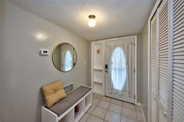 12532 115th St, Largo, FL 33778 - entrance foyer featuring visible vents, a textured ceiling, and light tile patterned flooring