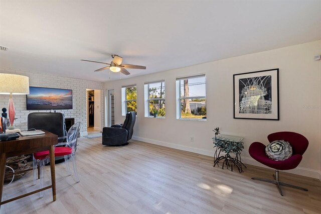 office space with visible vents, baseboards, wood finished floors, and ceiling fan