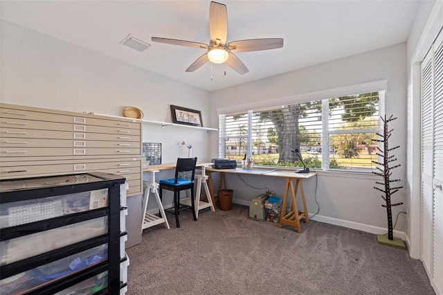 office with carpet, visible vents, ceiling fan, and a healthy amount of sunlight