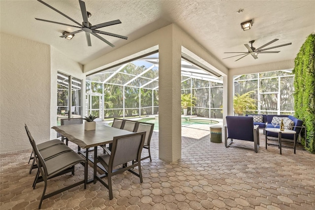 sunroom / solarium featuring outdoor lounge area, a ceiling fan, and outdoor dining space