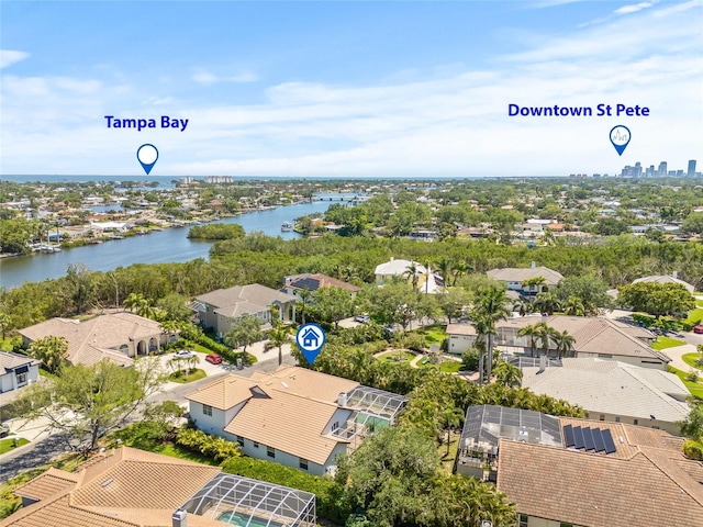 birds eye view of property with a residential view and a water view