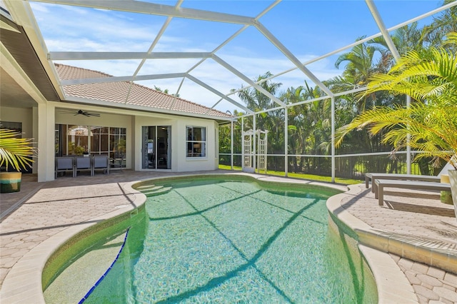 pool featuring a lanai, a patio, and ceiling fan