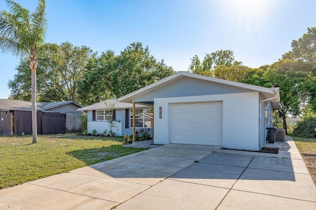 10137 Oleander Dr, Port Richey, FL 34668 - ranch-style house featuring central AC unit, driveway, and an attached garage