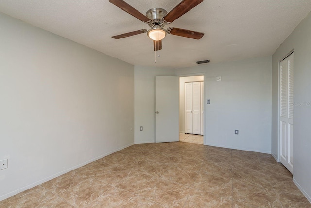 10137 Oleander Dr, Port Richey, FL 34668 - spare room featuring a ceiling fan and baseboards