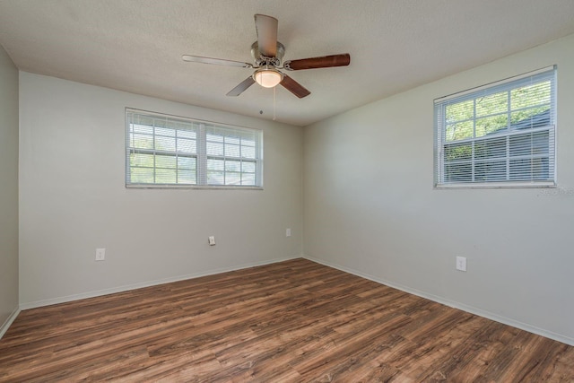 10137 Oleander Dr, Port Richey, FL 34668 - spare room featuring wood finished floors, ceiling fan, baseboards, and a textured ceiling