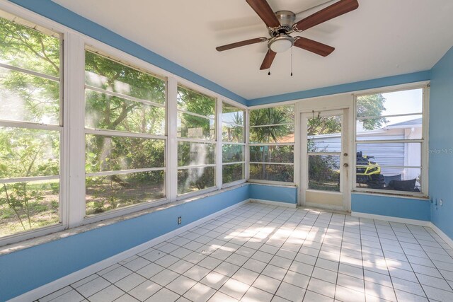 10137 Oleander Dr, Port Richey, FL 34668 - unfurnished sunroom featuring ceiling fan