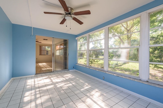 10137 Oleander Dr, Port Richey, FL 34668 - unfurnished sunroom featuring ceiling fan