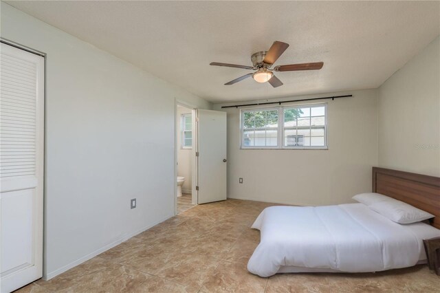 10137 Oleander Dr, Port Richey, FL 34668 - bedroom with ensuite bath and a ceiling fan