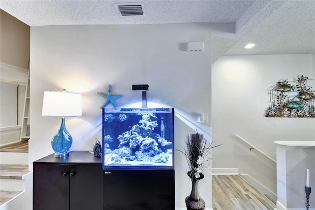 17960 Gulf Blvd Unit 111, Redington Shores, FL 33708 - interior space with recessed lighting, a textured ceiling, visible vents, and wood finished floors
