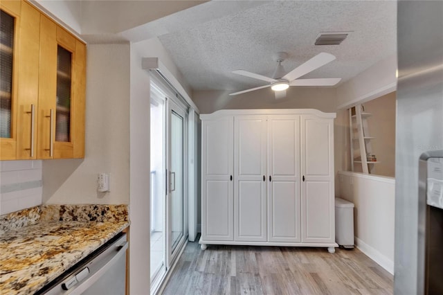 17960 Gulf Blvd Unit 111, Redington Shores, FL 33708 - interior space featuring visible vents, a ceiling fan, light wood finished floors, and a textured ceiling