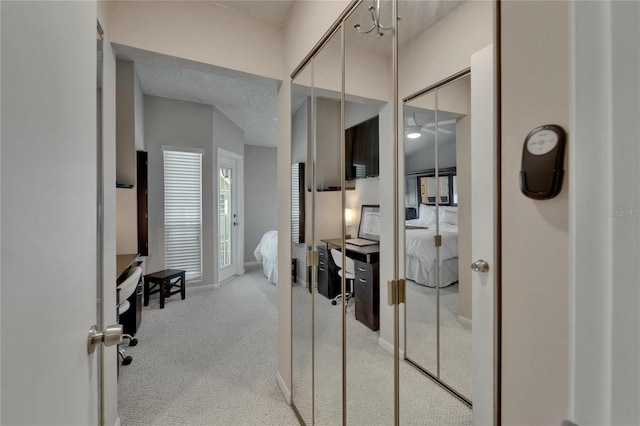 17960 Gulf Blvd Unit 111, Redington Shores, FL 33708 - hallway featuring carpet floors and baseboards