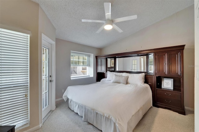 17960 Gulf Blvd Unit 111, Redington Shores, FL 33708 - bedroom featuring baseboards, light colored carpet, a textured ceiling, and lofted ceiling