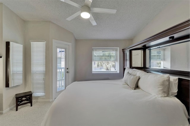 17960 Gulf Blvd Unit 111, Redington Shores, FL 33708 - carpeted bedroom with access to outside, a textured ceiling, a ceiling fan, and baseboards