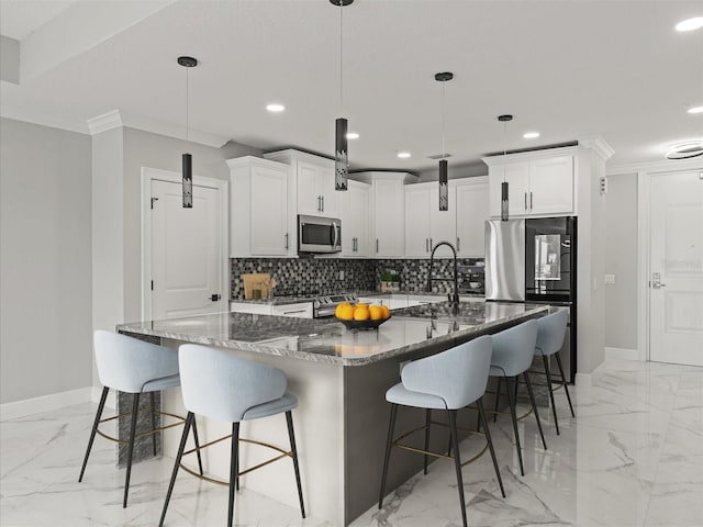 kitchen with stainless steel appliances, baseboards, recessed lighting, and marble finish floor