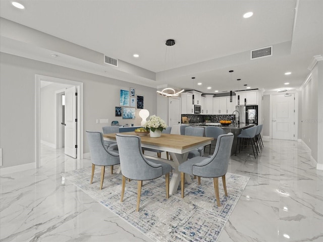 dining room featuring recessed lighting, visible vents, and marble finish floor