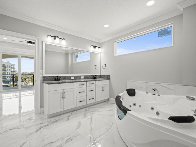 bathroom featuring crown molding, double vanity, marble finish floor, a tub with jets, and a sink