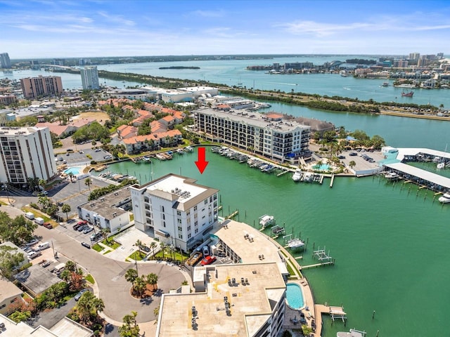 birds eye view of property featuring a city view and a water view