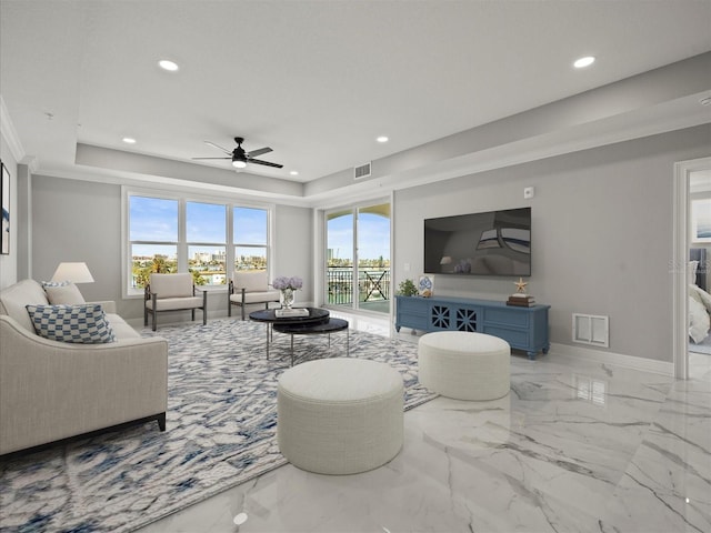 211 Dolphin Pt Unit 403, Clearwater Beach, FL 33767 - living room with a ceiling fan, recessed lighting, marble tiled floors, a tray ceiling, and baseboards