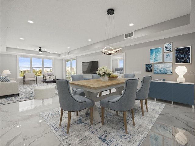211 Dolphin Pt Unit 403, Clearwater Beach, FL 33767 - dining space featuring a tray ceiling, light marble finish flooring, recessed lighting, and a ceiling fan