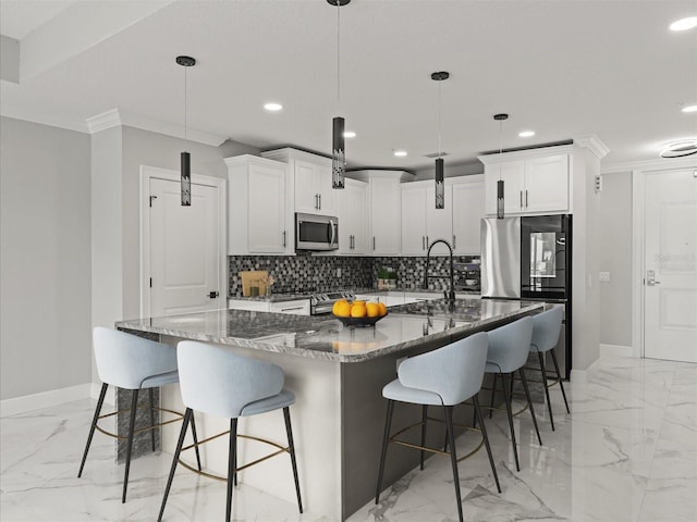 211 Dolphin Pt Unit 403, Clearwater Beach, FL 33767 - kitchen with appliances with stainless steel finishes, light marble finish flooring, baseboards, recessed lighting, and backsplash