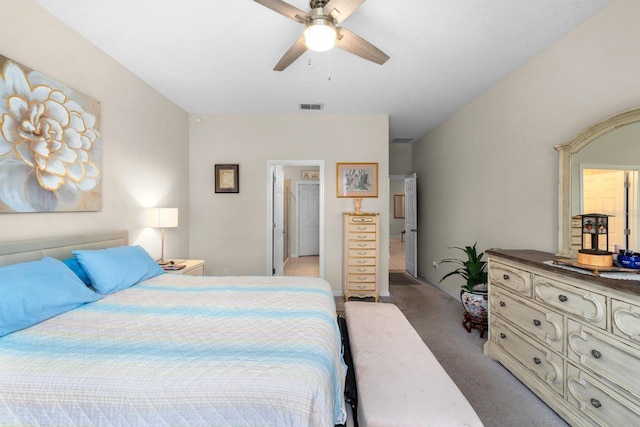 bedroom featuring light colored carpet, a ceiling fan, and visible vents