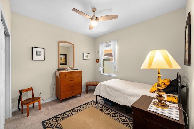 bedroom with baseboards, ceiling fan, and light colored carpet