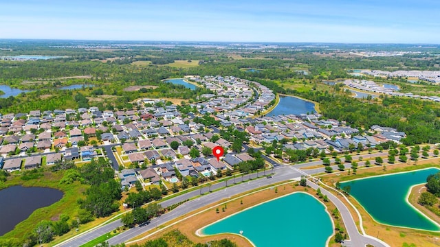 aerial view with a residential view and a water view