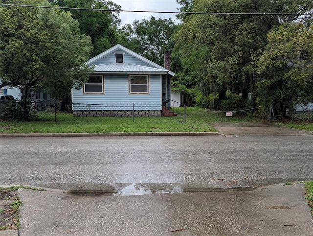 730 Citrus St, Orlando, FL 32805 - view of front of property with a chimney and metal roof