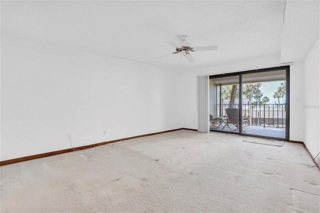 4450 Gulf Blvd Unit 114, St Pete Beach, FL 33706 - carpeted spare room with baseboards and a ceiling fan