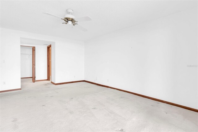 4450 Gulf Blvd Unit 114, St Pete Beach, FL 33706 - carpeted empty room featuring baseboards and ceiling fan