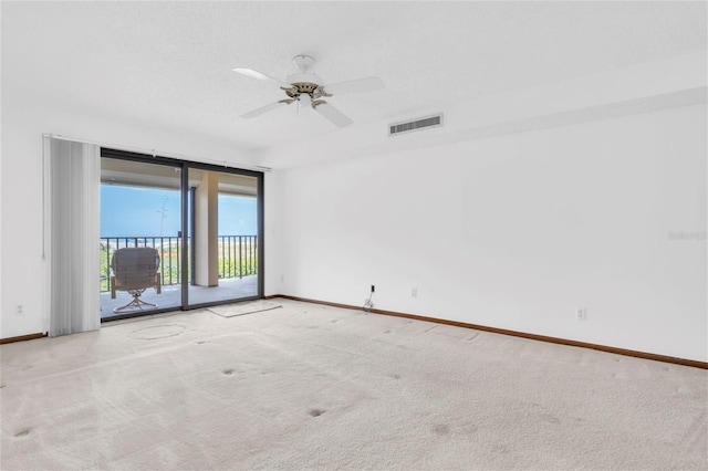 4450 Gulf Blvd Unit 114, St Pete Beach, FL 33706 - carpeted empty room featuring baseboards and a ceiling fan