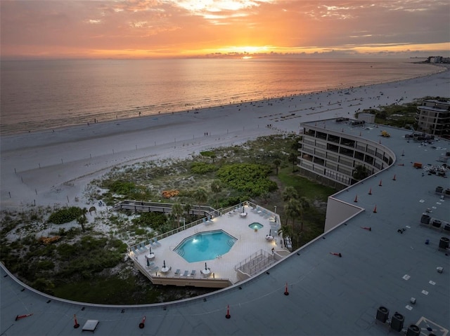 4450 Gulf Blvd Unit 114, St Pete Beach, FL 33706 - aerial view at dusk of view of pool and view of water and beach