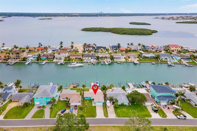 bird's eye view featuring a water view and a residential view
