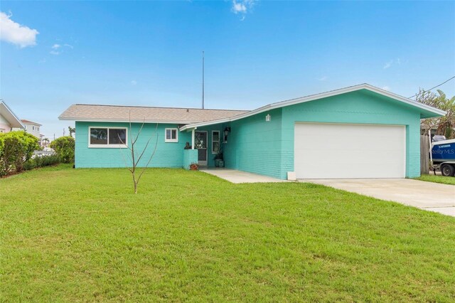 ranch-style house featuring an attached garage, a front lawn, and concrete driveway
