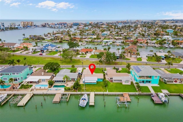 drone / aerial view with a water view and a residential view