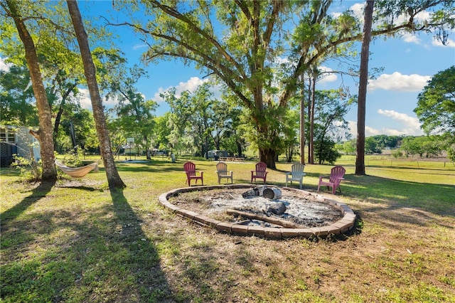 view of yard with an outdoor fire pit