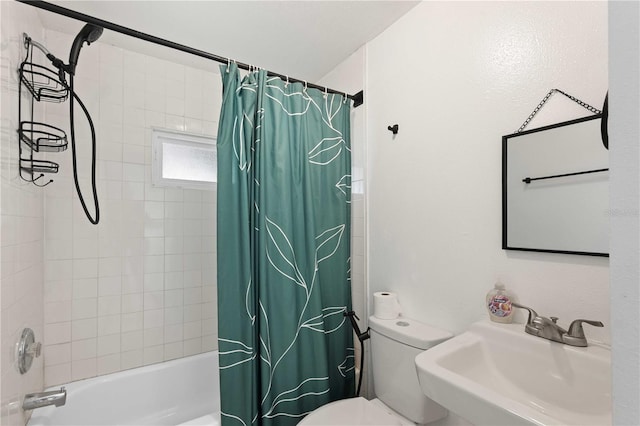 full bathroom with shower / bath combination with curtain, a sink, and toilet