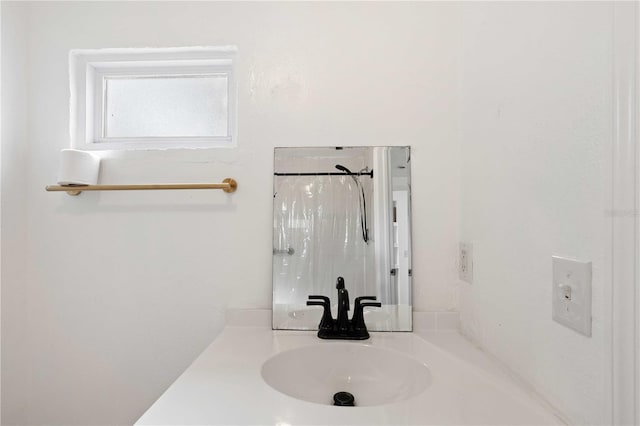 full bath featuring vanity and a shower with curtain