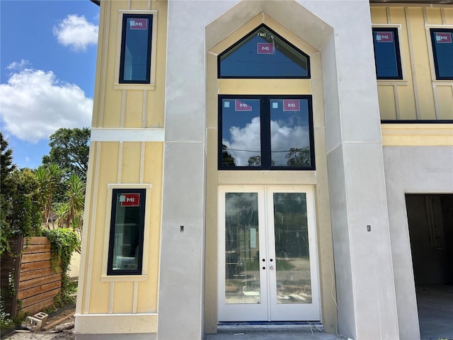 812 W Braddock St, Tampa, FL 33603 - entrance to property with french doors, board and batten siding, and stucco siding