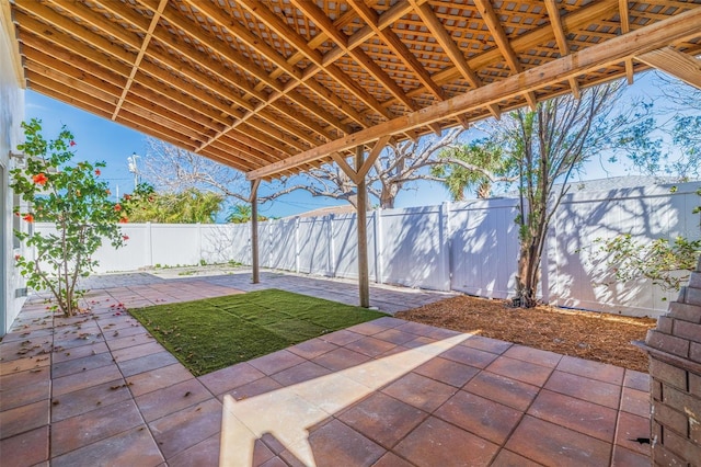 233 45th Ave, St Pete Beach, FL 33706 - fenced backyard featuring a patio area