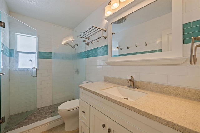 233 45th Ave, St Pete Beach, FL 33706 - bathroom with a shower stall, vanity, and tile walls