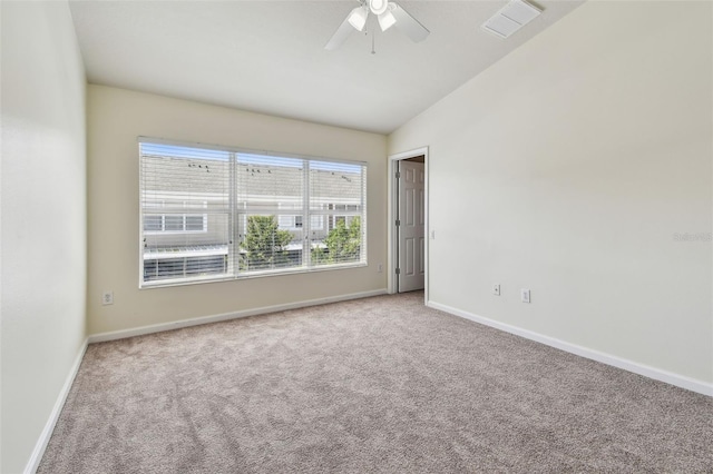 unfurnished room featuring ceiling fan, carpet floors, visible vents, and baseboards