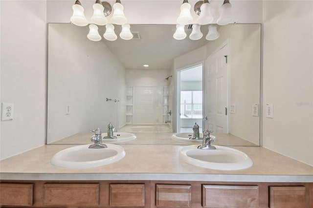 bathroom with a chandelier, a sink, and bathing tub / shower combination
