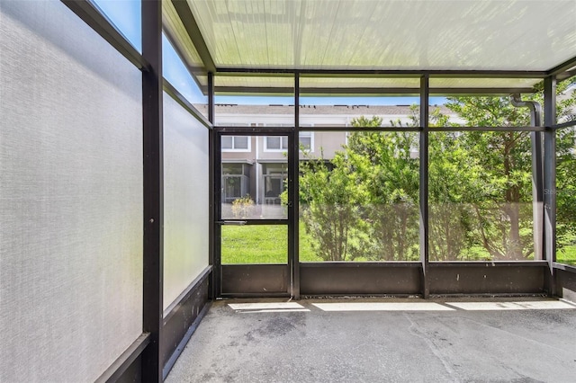 unfurnished sunroom with a wealth of natural light