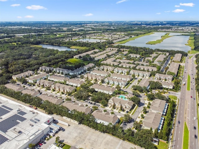 bird's eye view featuring a residential view and a water view