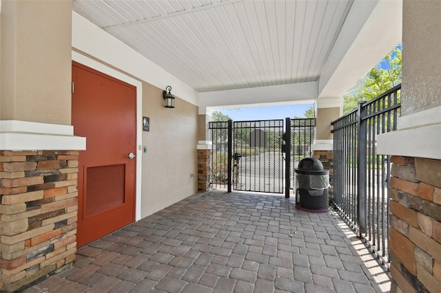 exterior space with a gate and visible vents